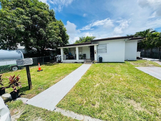 7230 NW 3rd St, Miami, FL 33126 - view of front of house with stucco siding and a porch