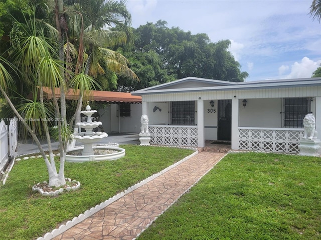 305 NW Opa Locka Blvd, North Miami, FL 33168 - view of front of property featuring a porch