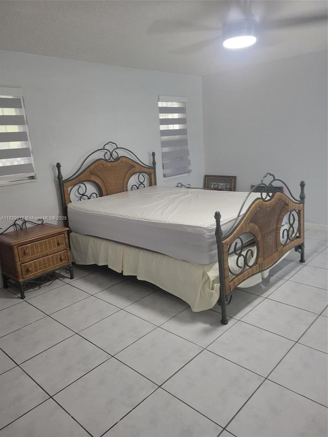 305 NW Opa Locka Blvd, North Miami, FL 33168 - bedroom featuring light tile patterned floors and a ceiling fan