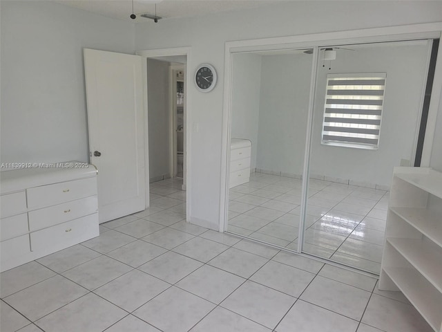 305 NW Opa Locka Blvd, North Miami, FL 33168 - unfurnished bedroom featuring light tile patterned floors and a closet
