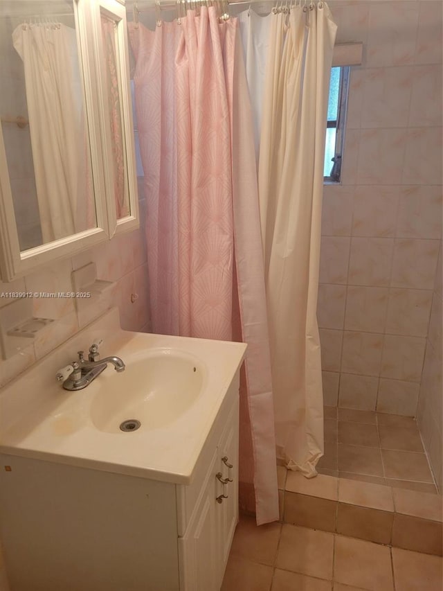 305 NW Opa Locka Blvd, North Miami, FL 33168 - bathroom with vanity, tiled shower, and tile patterned floors