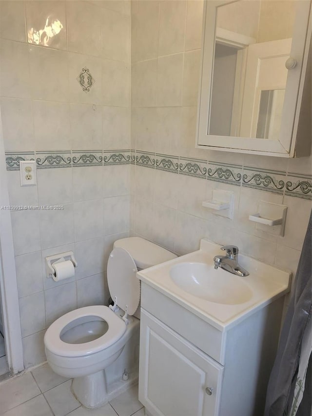 305 NW Opa Locka Blvd, North Miami, FL 33168 - bathroom featuring tile walls, vanity, and tile patterned floors