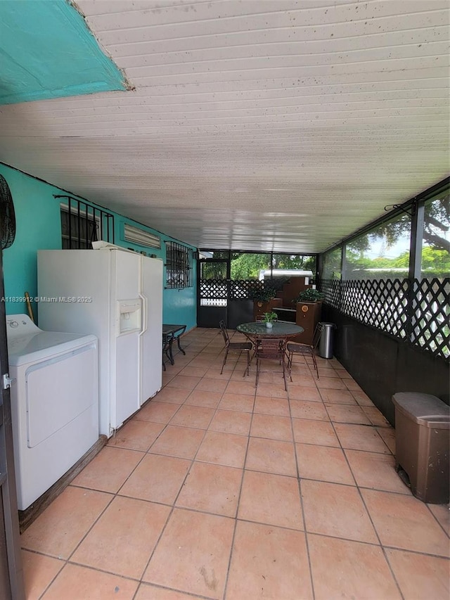 305 NW Opa Locka Blvd, North Miami, FL 33168 - view of patio / terrace featuring washer / dryer and outdoor dining space
