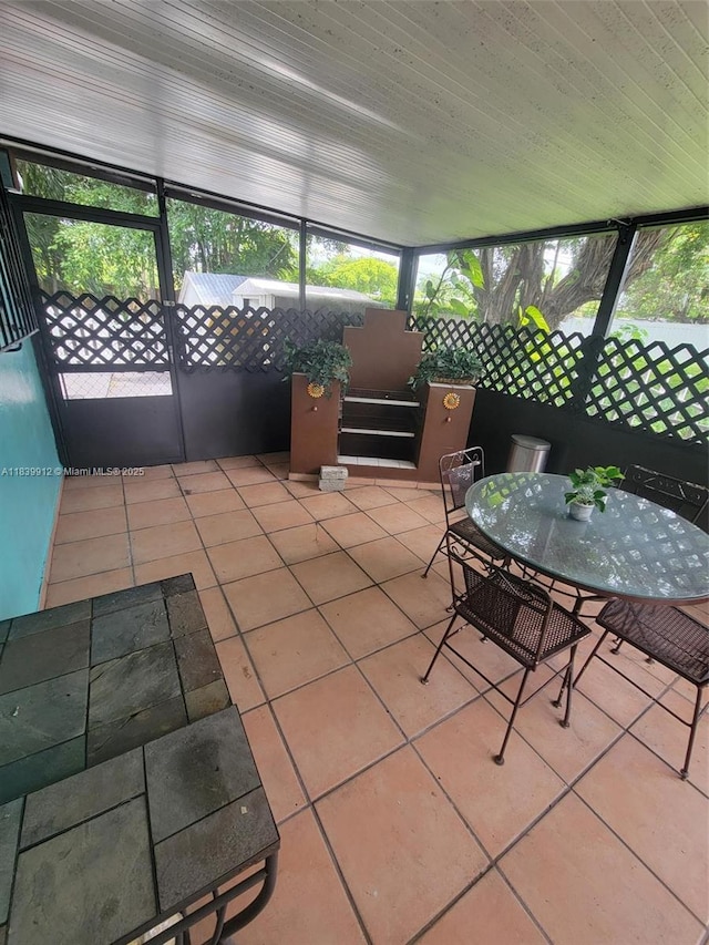 305 NW Opa Locka Blvd, North Miami, FL 33168 - sunroom with plenty of natural light and outdoor dining space
