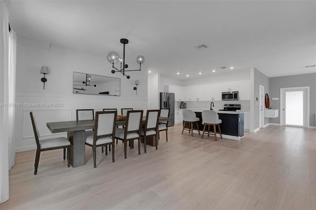 14864 SW 163rd Ter, Miami, FL 33187 - dining room featuring a chandelier, light wood-style floors, and recessed lighting