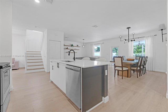 14864 SW 163rd Ter, Miami, FL 33187 - kitchen featuring appliances with stainless steel finishes, plenty of natural light, a kitchen island with sink, light wood-style floors, and recessed lighting