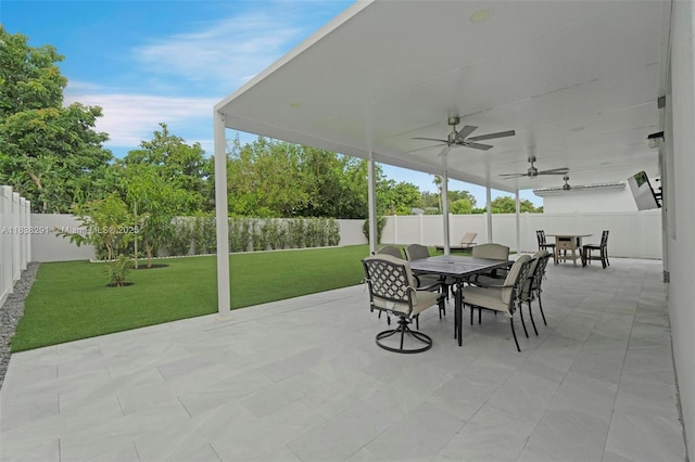 14864 SW 163rd Ter, Miami, FL 33187 - fenced backyard featuring outdoor dining space, ceiling fan, and a patio area