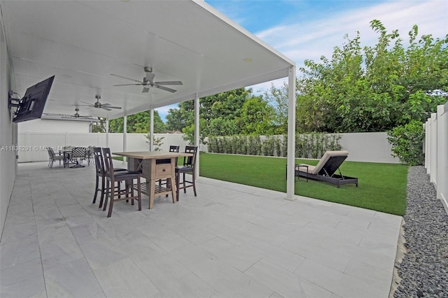 14864 SW 163rd Ter, Miami, FL 33187 - fenced backyard featuring outdoor dining space, ceiling fan, and a patio area