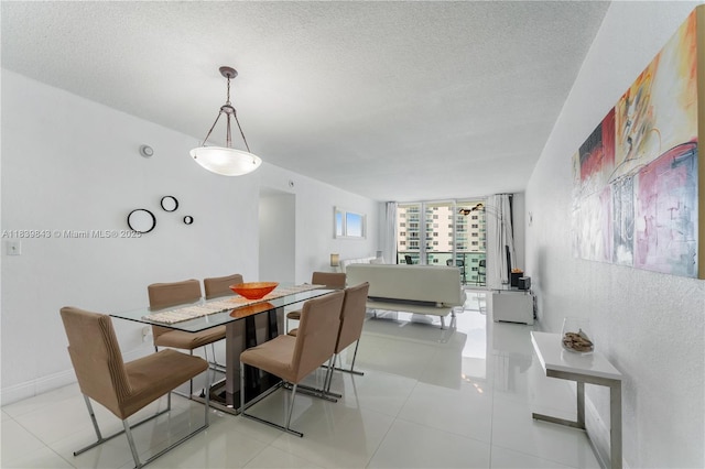 3901 S Ocean Dr Unit 10C, Hollywood, FL 33019 - dining room with a textured ceiling