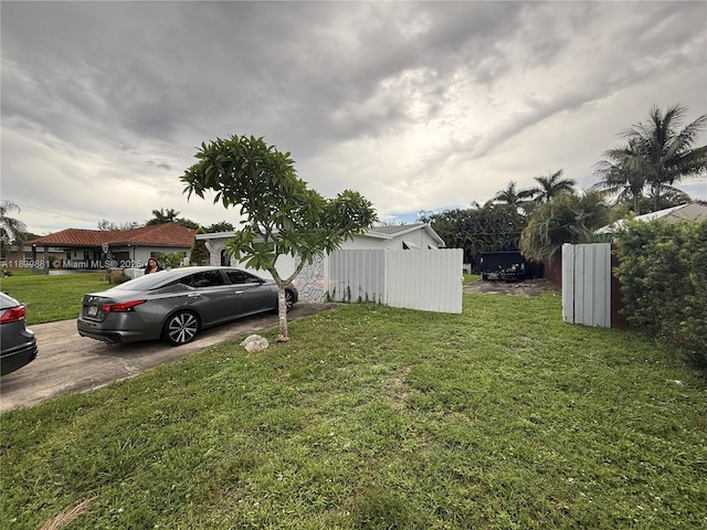 6550 SW 56th St, Davie, FL 33314 - view of yard featuring concrete driveway