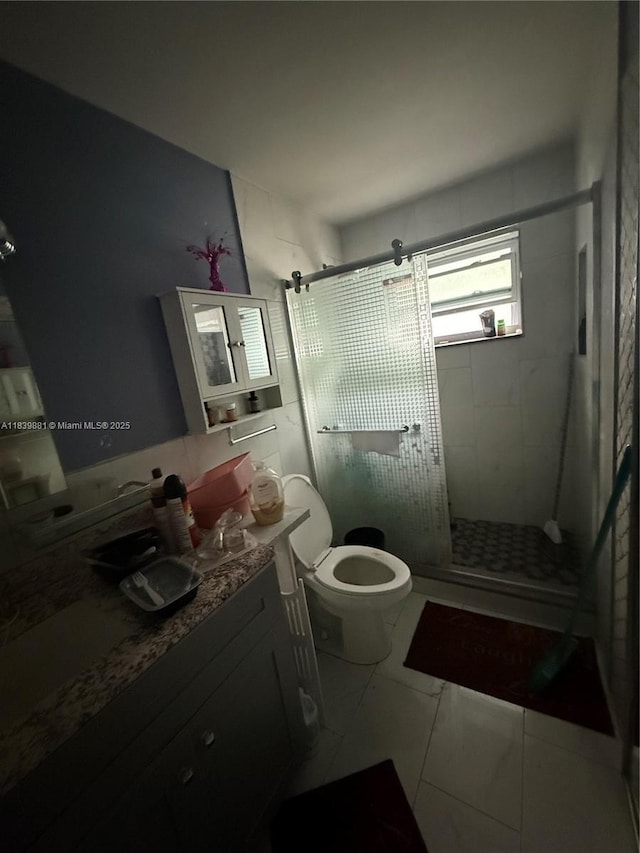 6550 SW 56th St, Davie, FL 33314 - bathroom featuring vanity, a shower stall, and marble look tiles