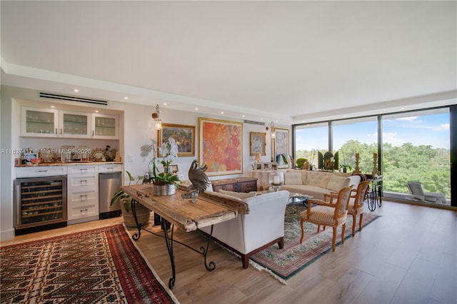 700 Coral Way Unit 4, Coral Gables, FL 33134 - living area featuring beverage cooler, bar, expansive windows, light wood-type flooring, and recessed lighting