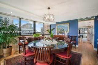 700 Coral Way Unit 4, Coral Gables, FL 33134 - dining area with a chandelier and wood finished floors