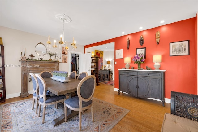 1420 NE 15th Ave, Fort Lauderdale, FL 33304 - dining area featuring a chandelier, wood finished floors, and recessed lighting