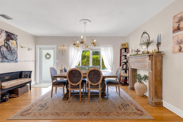 1420 NE 15th Ave, Fort Lauderdale, FL 33304 - dining area featuring a chandelier and light wood finished floors