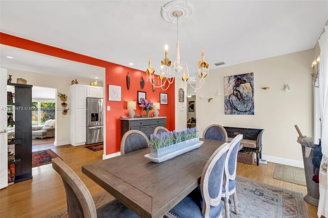 1420 NE 15th Ave, Fort Lauderdale, FL 33304 - dining room with a chandelier, light wood-type flooring, and recessed lighting
