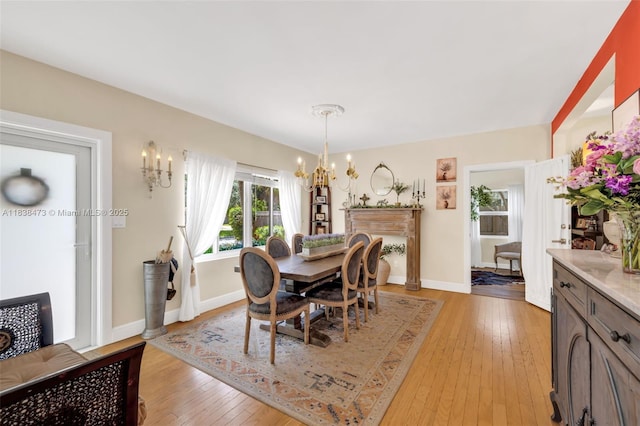 1420 NE 15th Ave, Fort Lauderdale, FL 33304 - dining area featuring a chandelier and light wood-style flooring
