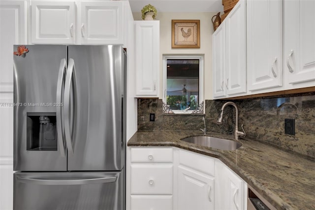 1420 NE 15th Ave, Fort Lauderdale, FL 33304 - kitchen with stainless steel appliances, tasteful backsplash, white cabinetry, and dark stone countertops