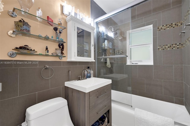 1420 NE 15th Ave, Fort Lauderdale, FL 33304 - bathroom with vanity, tile walls, and shower / bath combination with glass door