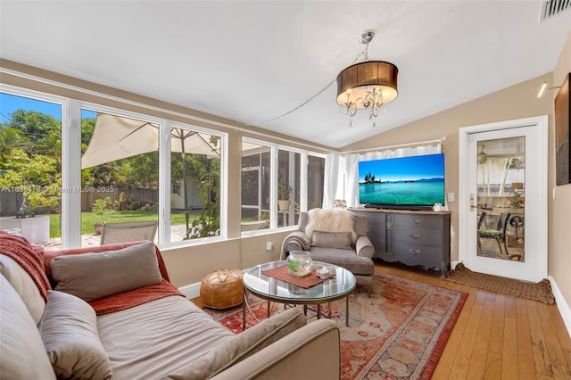 1420 NE 15th Ave, Fort Lauderdale, FL 33304 - sunroom featuring vaulted ceiling, wood-type flooring, and a chandelier