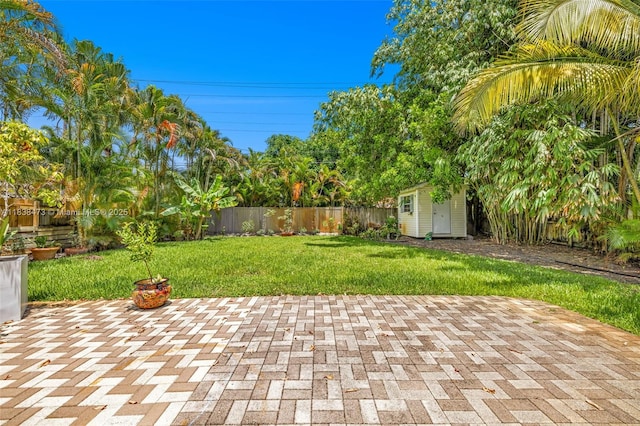 1420 NE 15th Ave, Fort Lauderdale, FL 33304 - fenced backyard featuring a storage unit and a patio area