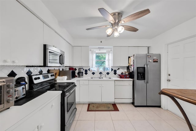 500 S Luna Ct Unit 6, Hollywood, FL 33021 - kitchen with appliances with stainless steel finishes, decorative backsplash, light countertops, a ceiling fan, and white cabinets