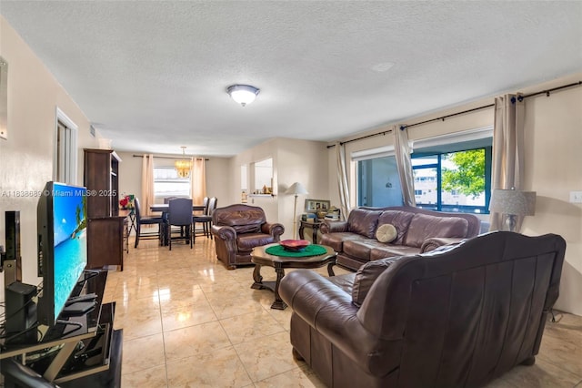 500 S Luna Ct Unit 6, Hollywood, FL 33021 - living area with a textured ceiling and a chandelier