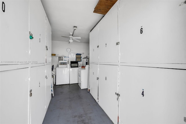 500 S Luna Ct Unit 6, Hollywood, FL 33021 - kitchen featuring finished concrete floors, ceiling fan, white cabinets, and washer and dryer