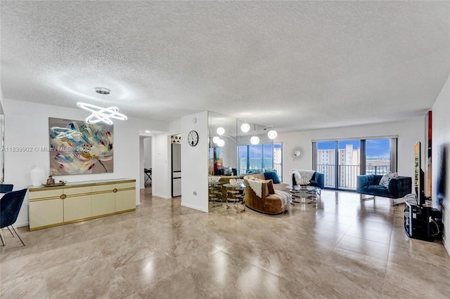 1201 S Ocean Dr Unit 904N, Hollywood, FL 33019 - living area with a chandelier and a textured ceiling