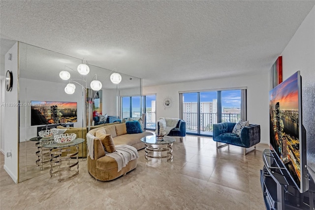 1201 S Ocean Dr Unit 904N, Hollywood, FL 33019 - living area featuring a textured ceiling