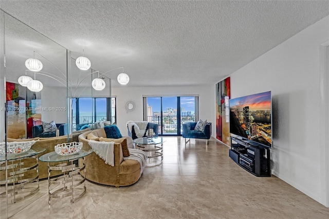 1201 S Ocean Dr Unit 904N, Hollywood, FL 33019 - living room featuring a textured ceiling