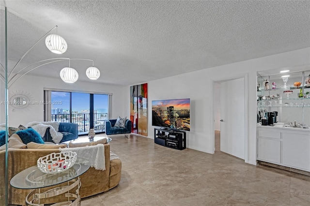 1201 S Ocean Dr Unit 904N, Hollywood, FL 33019 - living room featuring a textured ceiling