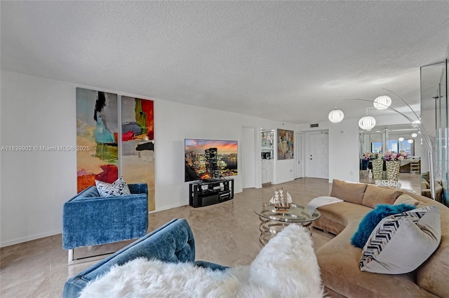 1201 S Ocean Dr Unit 904N, Hollywood, FL 33019 - living area with a textured ceiling