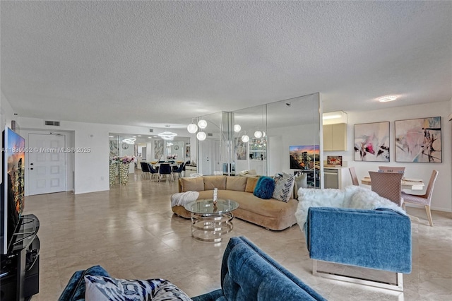 1201 S Ocean Dr Unit 904N, Hollywood, FL 33019 - living room with a textured ceiling
