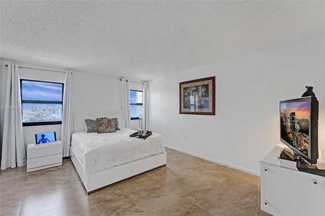 1201 S Ocean Dr Unit 904N, Hollywood, FL 33019 - bedroom with multiple windows and a textured ceiling
