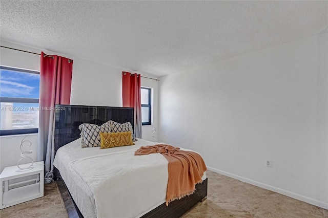1201 S Ocean Dr Unit 904N, Hollywood, FL 33019 - carpeted bedroom featuring a textured ceiling and baseboards