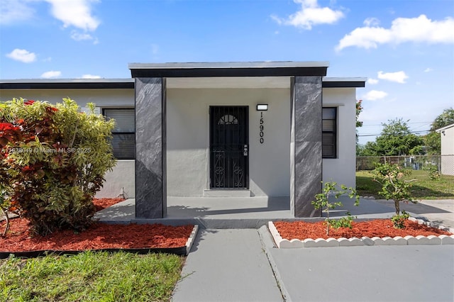 15900 NW 18th Ave, Miami Gardens, FL 33054 - property entrance featuring stucco siding