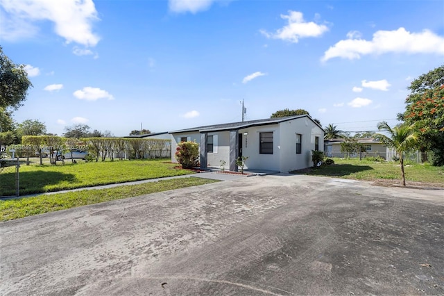 15900 NW 18th Ave, Miami Gardens, FL 33054 - ranch-style home with stucco siding and driveway