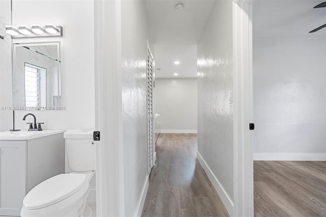15900 NW 18th Ave, Miami Gardens, FL 33054 - bathroom featuring wood finished floors, vanity, and a ceiling fan
