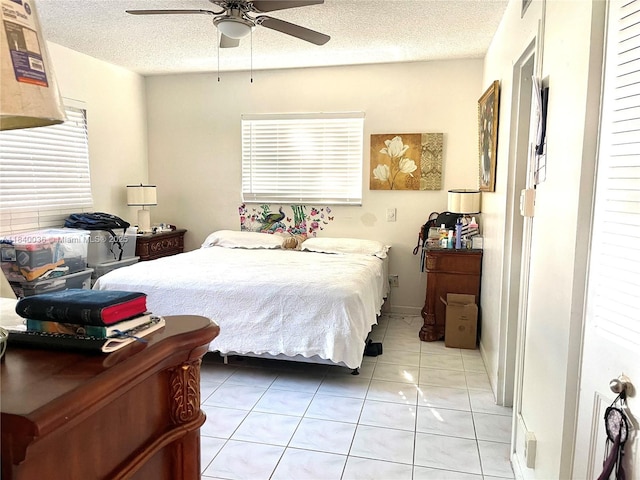 1015 Country Club Dr Unit 109, Margate, FL 33063 - bedroom with light tile patterned floors, a textured ceiling, and a ceiling fan