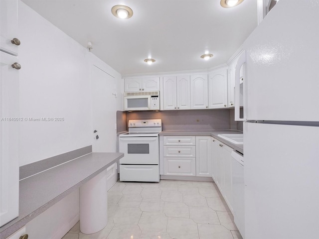 400 Kings Point Dr Unit 523, Sunny Isles Beach, FL 33160 - kitchen featuring white appliances and white cabinets