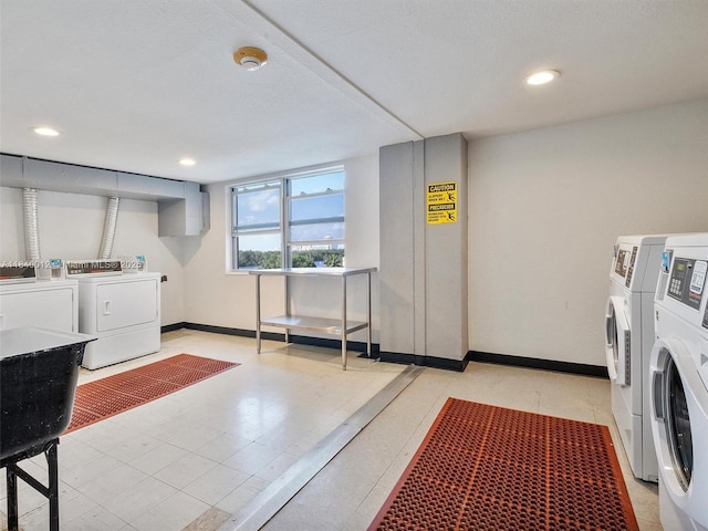 400 Kings Point Dr Unit 523, Sunny Isles Beach, FL 33160 - communal laundry room featuring independent washer and dryer and recessed lighting