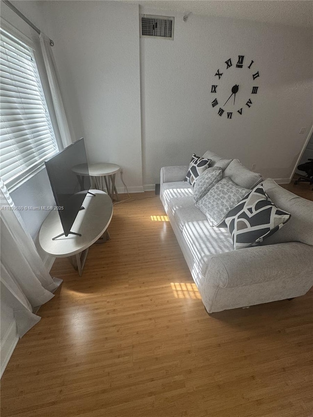 6001 SW 70th St Unit 304, South Miami, FL 33143 - bedroom featuring baseboards and light wood-type flooring