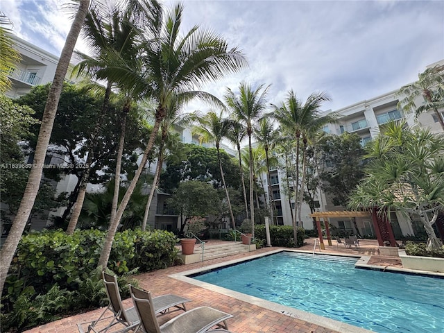 6001 SW 70th St Unit 304, South Miami, FL 33143 - community pool with a pergola and a patio area
