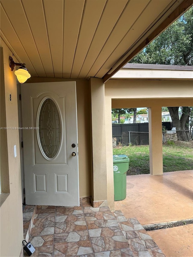 658 SE 8th Pl, Hialeah, FL 33010 - property entrance with stucco siding and a patio