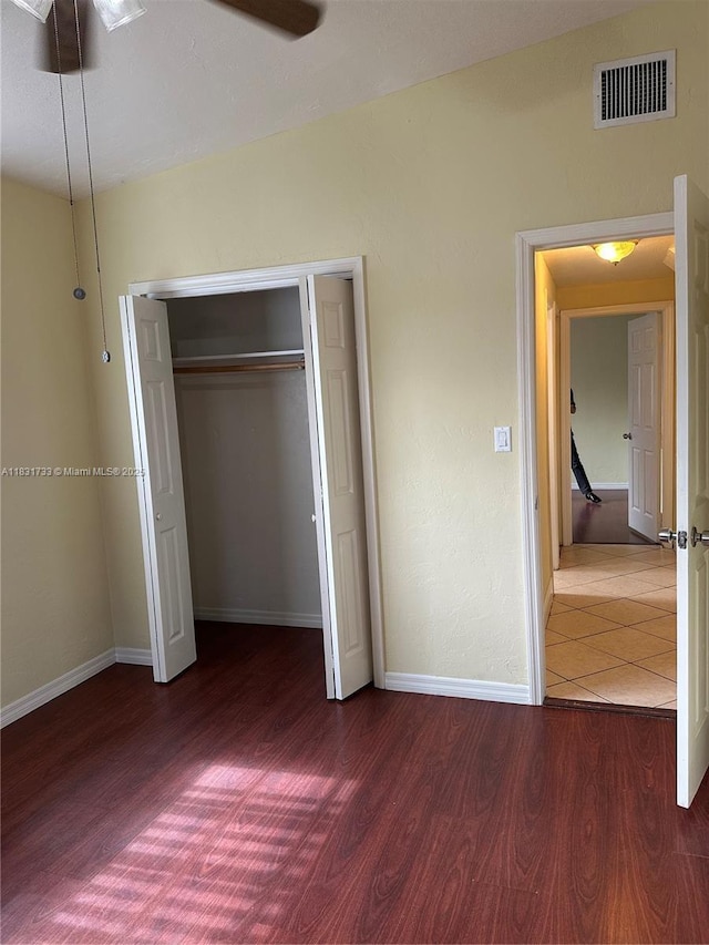658 SE 8th Pl, Hialeah, FL 33010 - unfurnished bedroom with wood finished floors and a closet