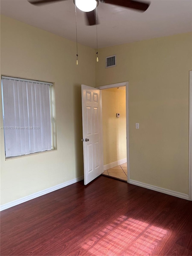 658 SE 8th Pl, Hialeah, FL 33010 - spare room featuring ceiling fan and wood finished floors