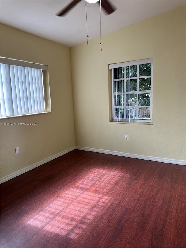 658 SE 8th Pl, Hialeah, FL 33010 - empty room featuring wood finished floors, ceiling fan, and plenty of natural light