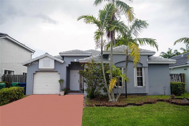 14677 SW 123rd Ave, Miami, FL 33186 - view of front of home with a garage, stucco siding, and concrete driveway
