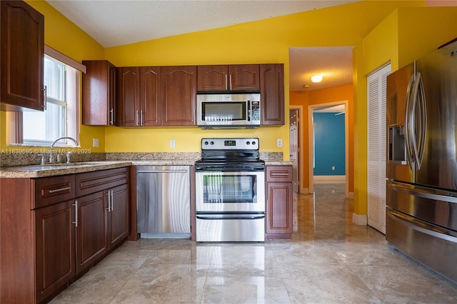 14677 SW 123rd Ave, Miami, FL 33186 - kitchen featuring stainless steel appliances, lofted ceiling, and light stone counters
